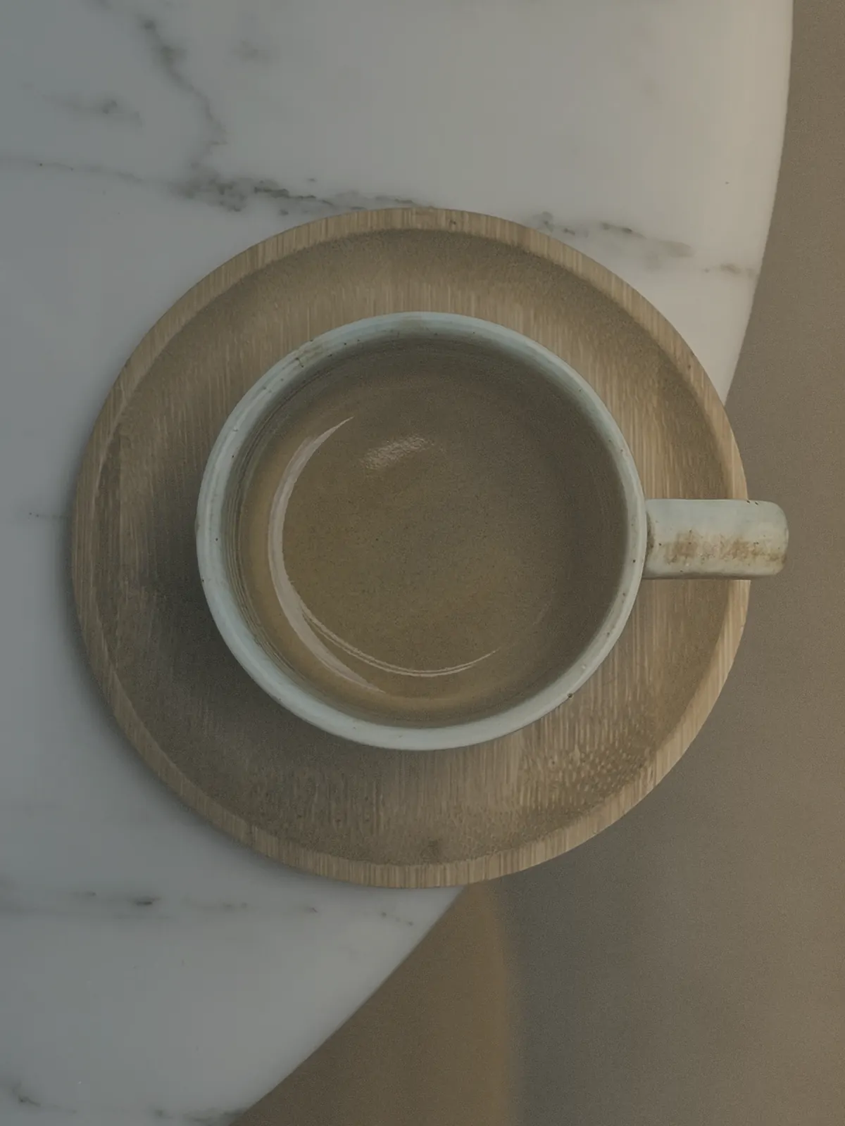 A quiet cup on marble suggesting reflection, conversation, and private support